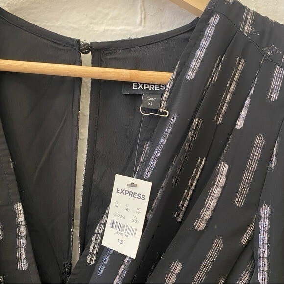 NWT Express Metallic Faux Wrap
Ruched Front Asymmetrical Midi
Dress Black XS - Picture 9 of 12